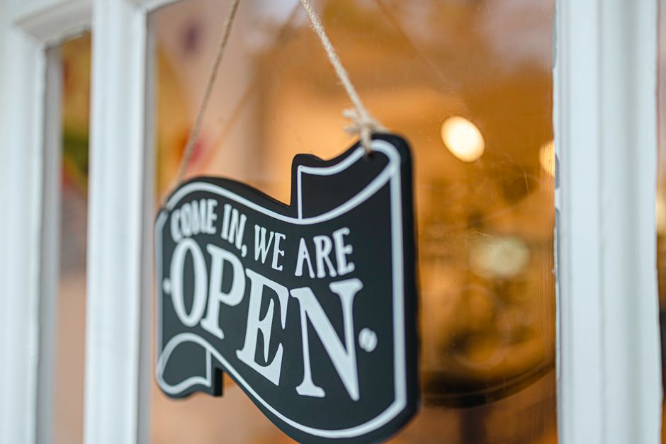 Open front door welcoming visitors into a home